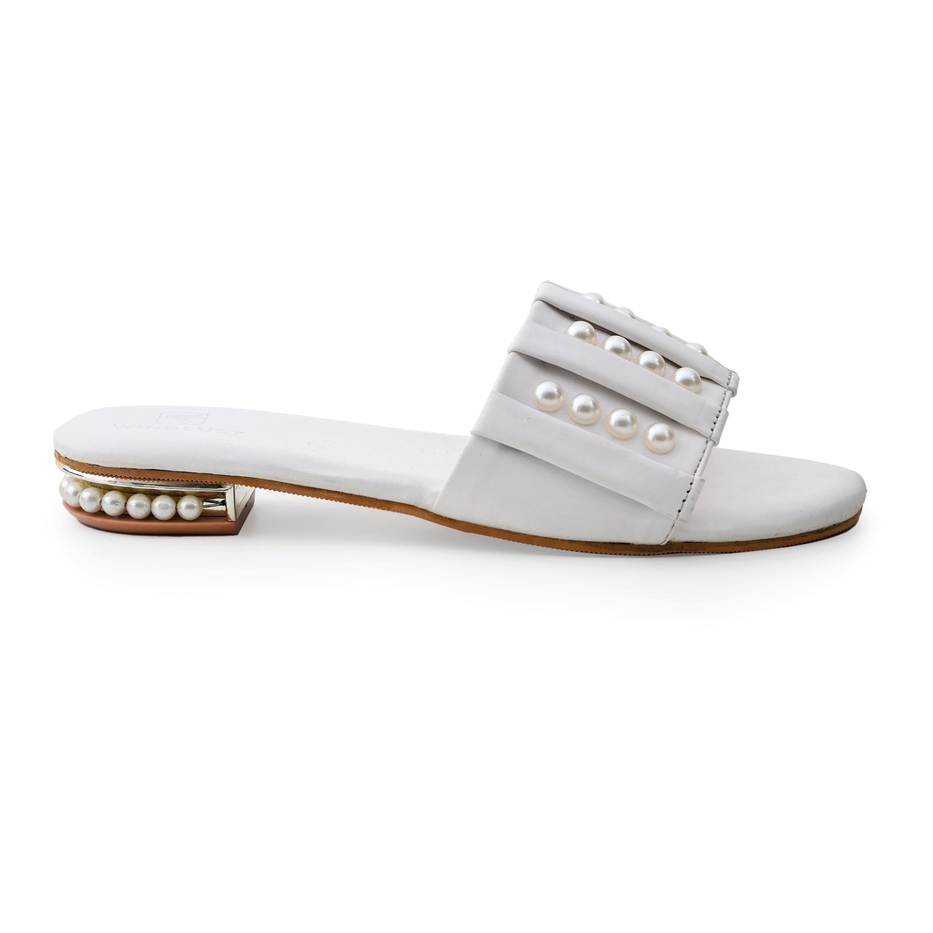 White linear pearl flats by Windlust featuring a sleek design and comfortable slip-on style.
