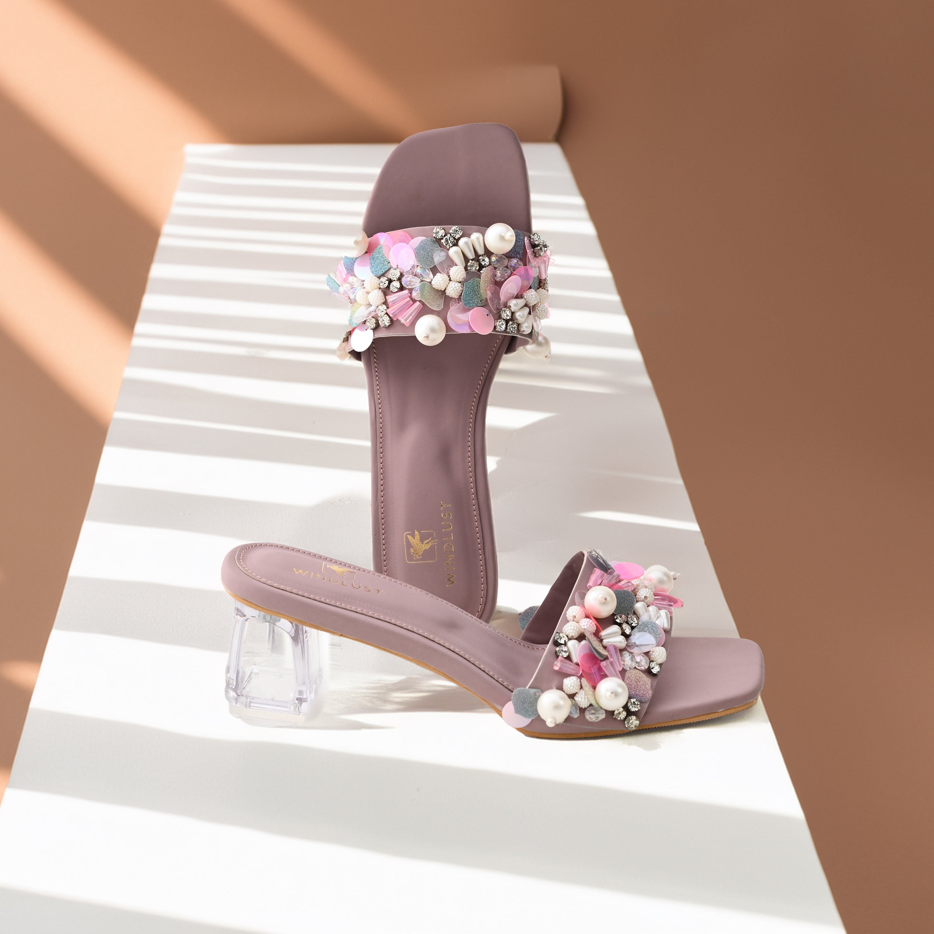 Hand-embellished mauve luxury heels by Windlust, featuring intricate details and elegant design for stylish footwear.