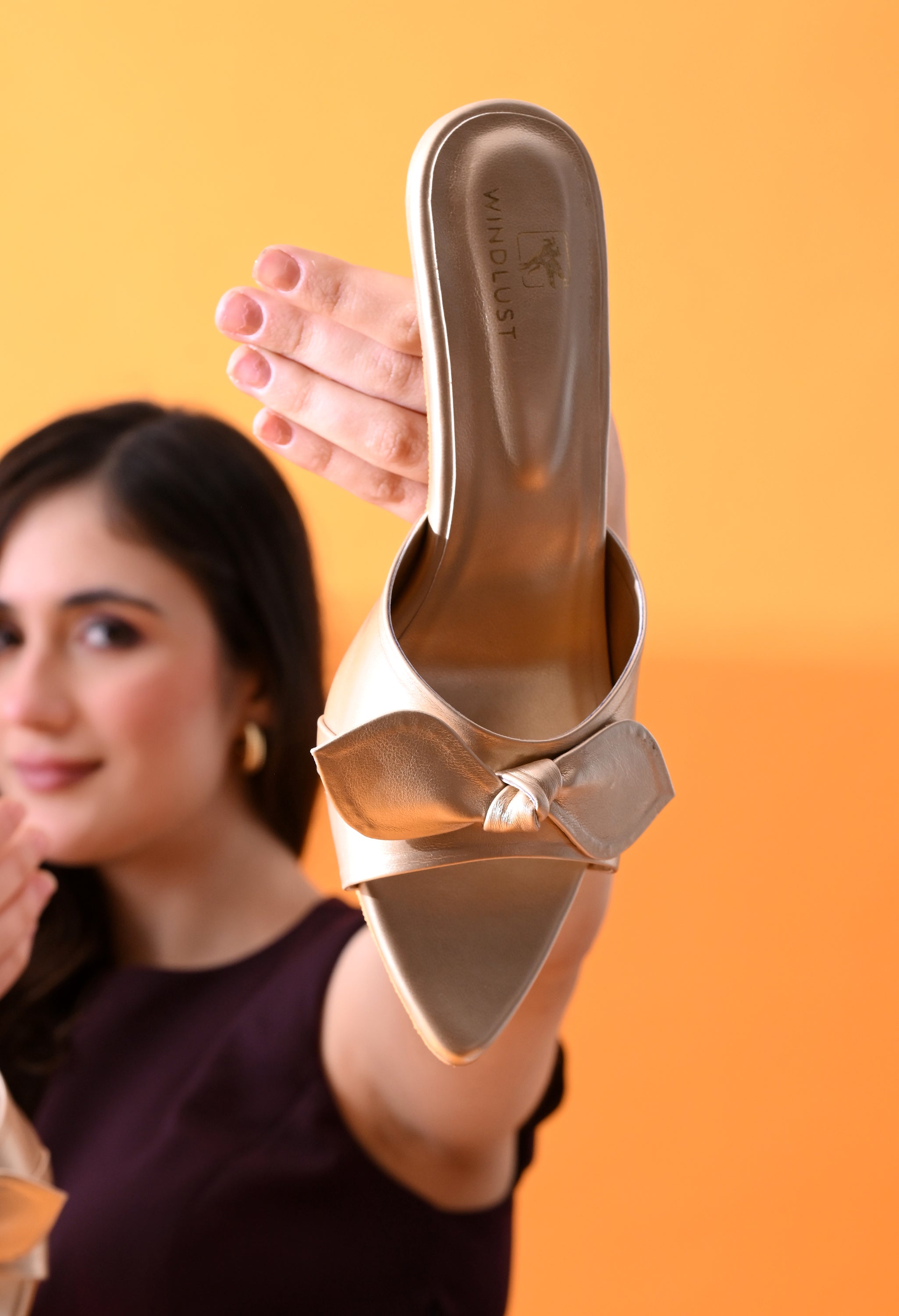 Handmade Aura Gold kitten heels with decorative bows by Windlust, featuring a stylish and elegant design.