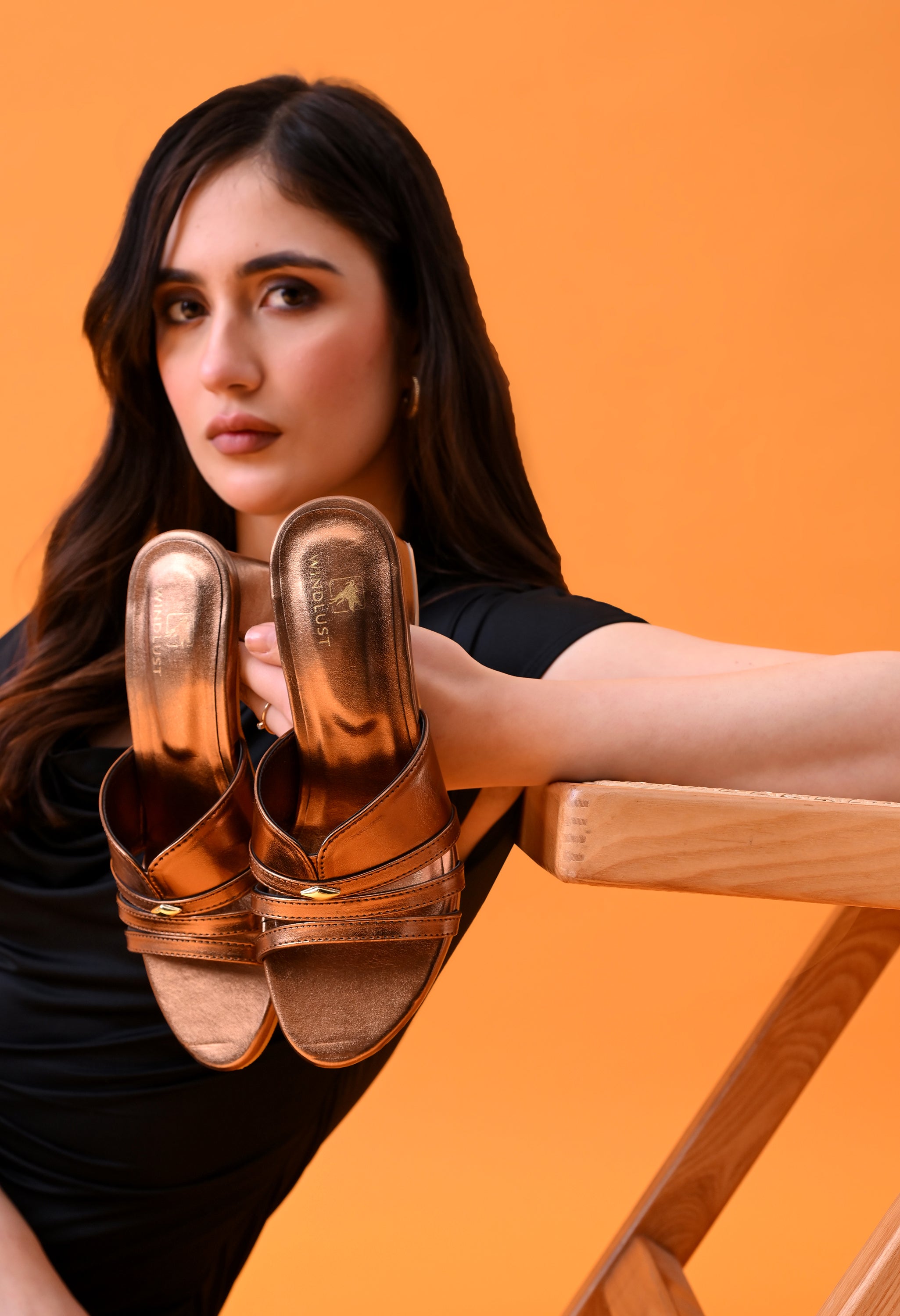 Shimmery deep copper block heels by Windlust featuring a stylish, chunky heel design and metallic finish.