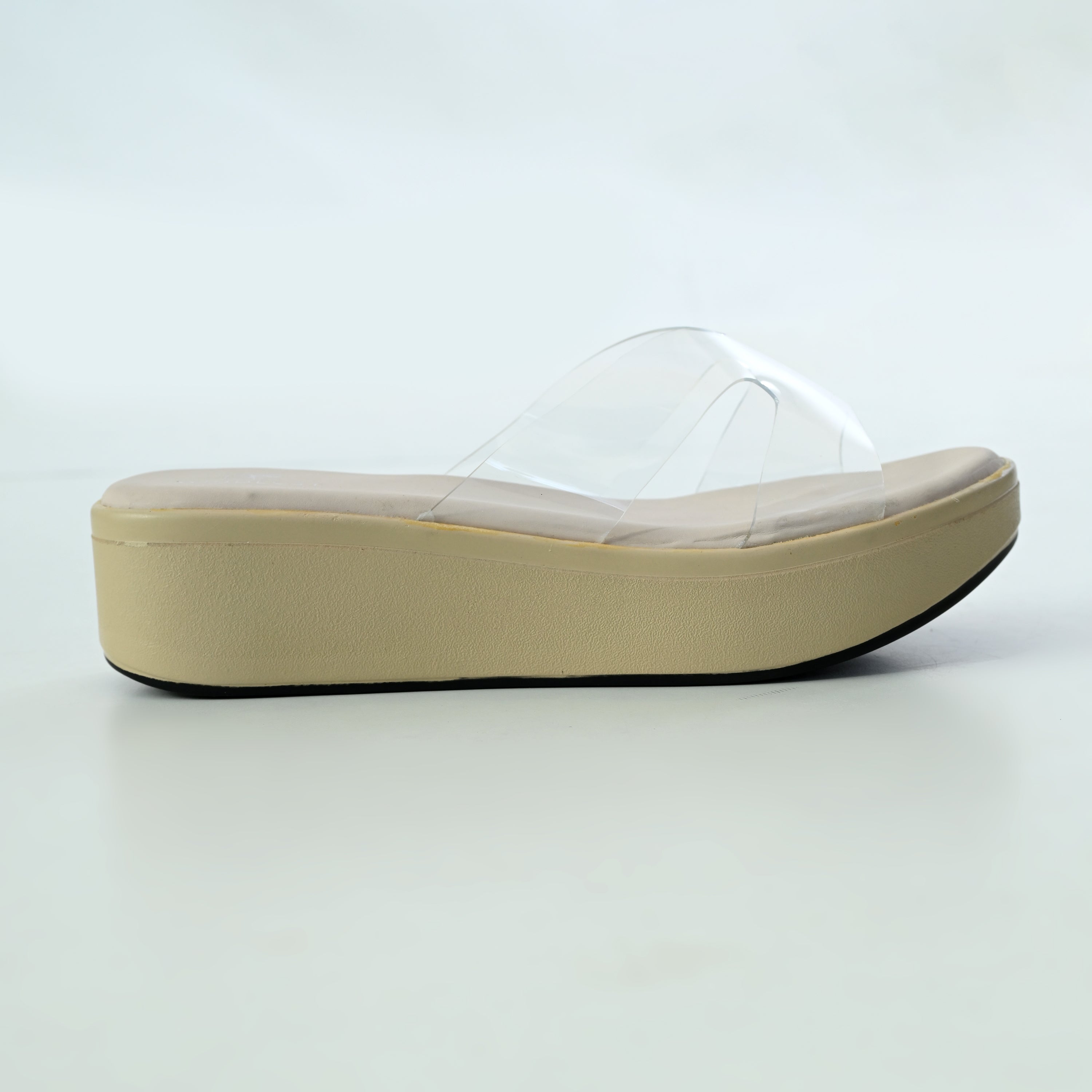 Cream-colored CLEAR X-FLOW wedge sandal by Windlust with transparent heel and open toe design.