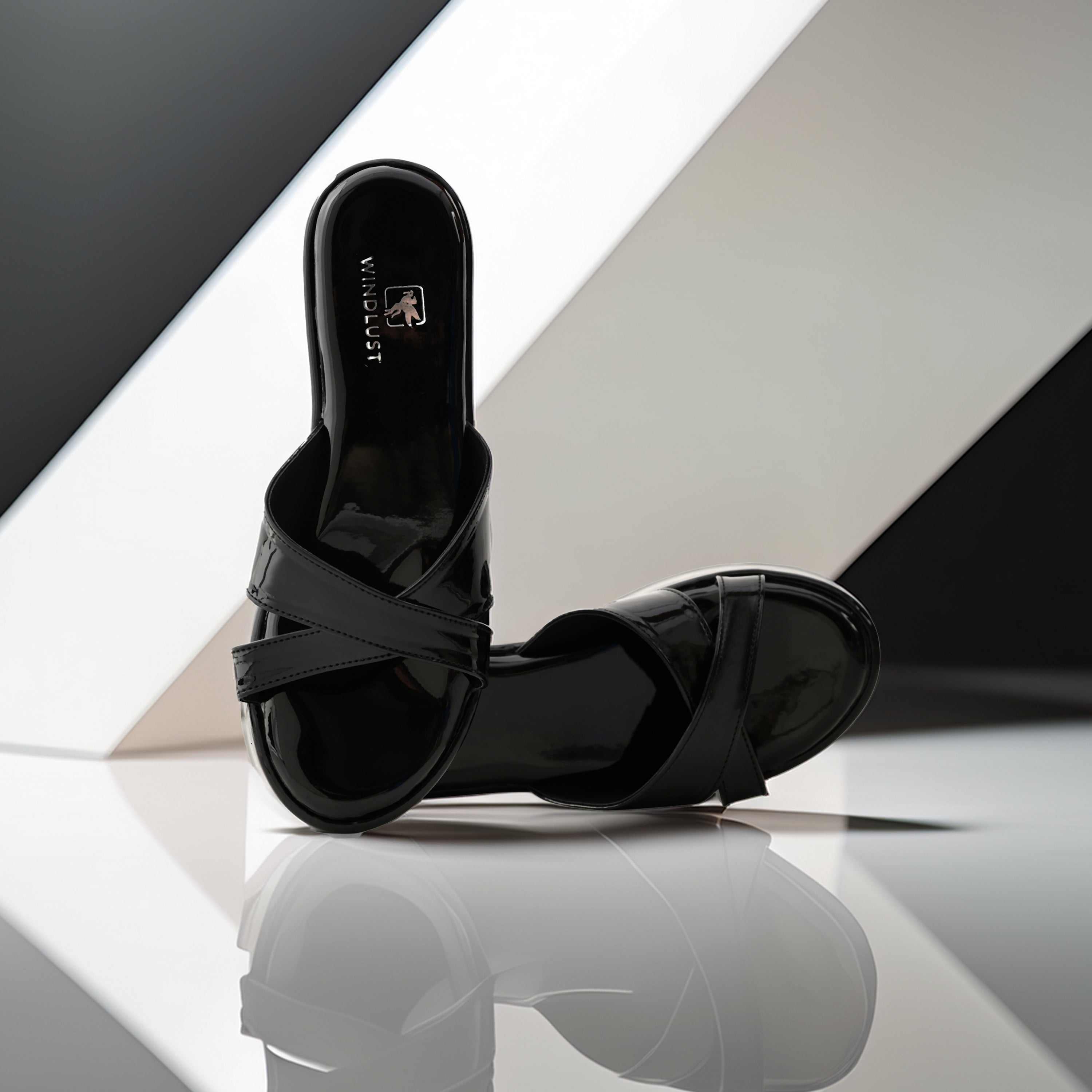 Glossy black Cross Strap Wedges by Windlust featuring stylish straps and a comfortable wedge heel.