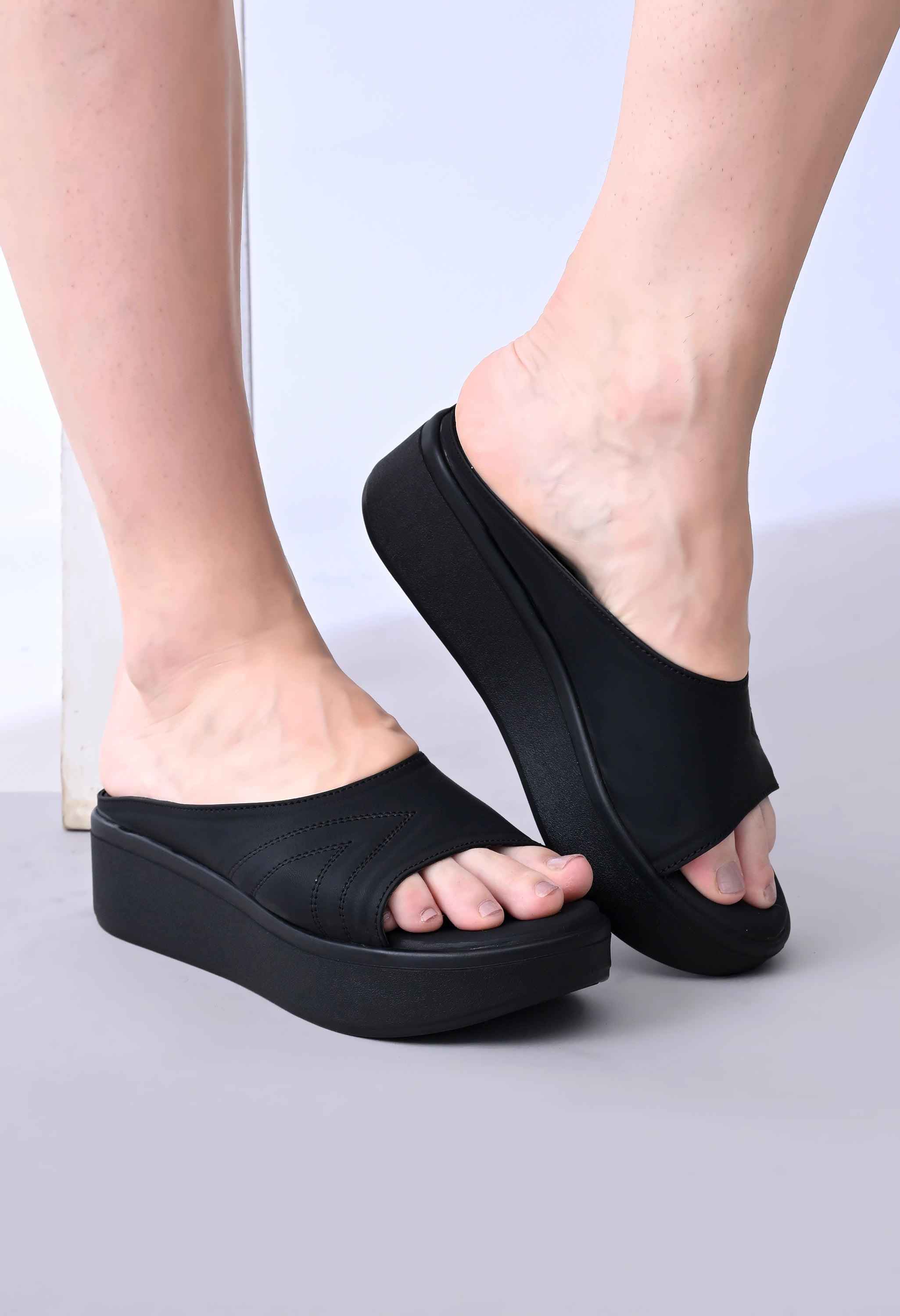 Windlust Luxè Sewed In Wedge in Dense Black, stylish wedge footwear with a sleek design and comfortable fit.