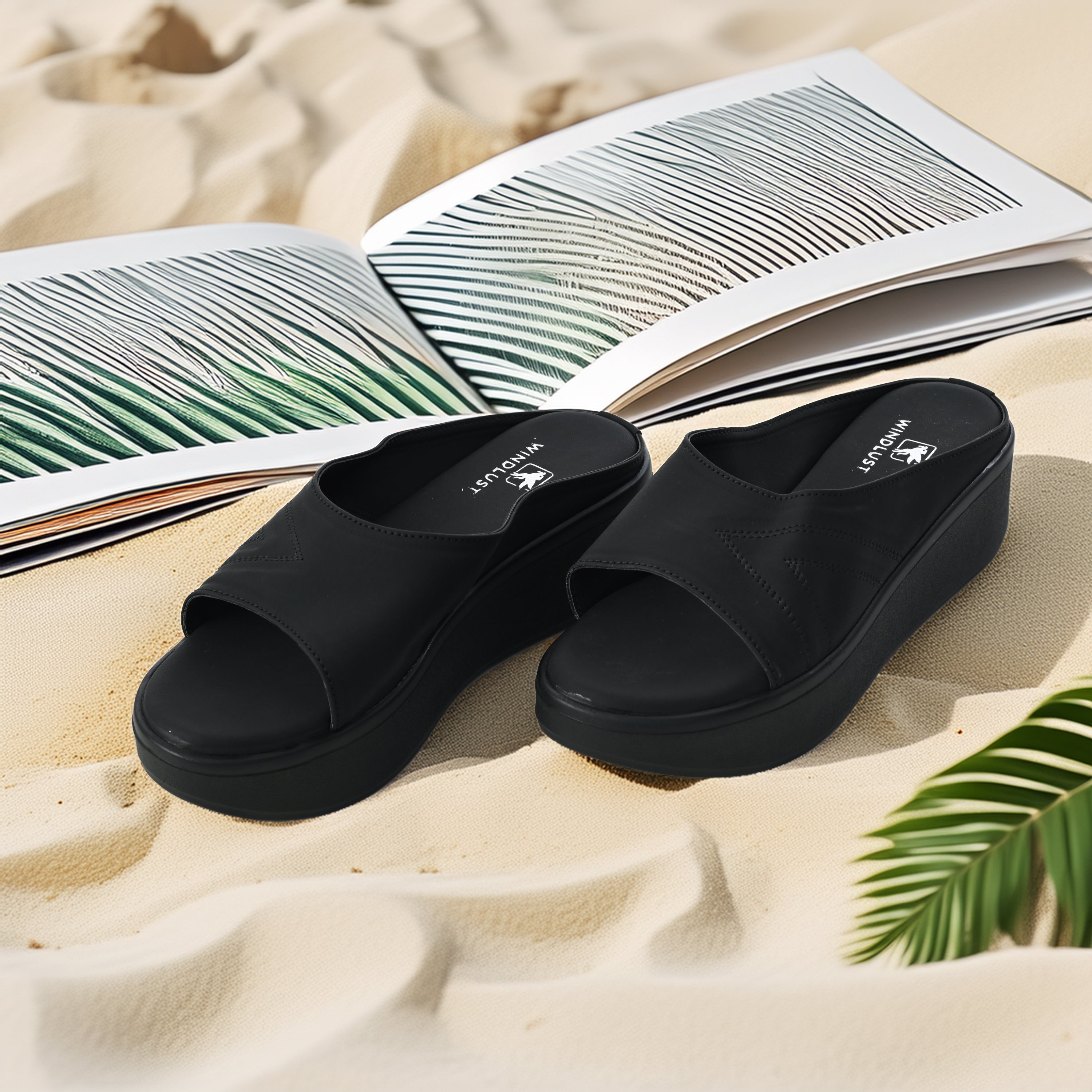 Close-up of Windlust Luxè Sewed In Wedge in Dense Black, showing the textured black wedge heel and sleek design.