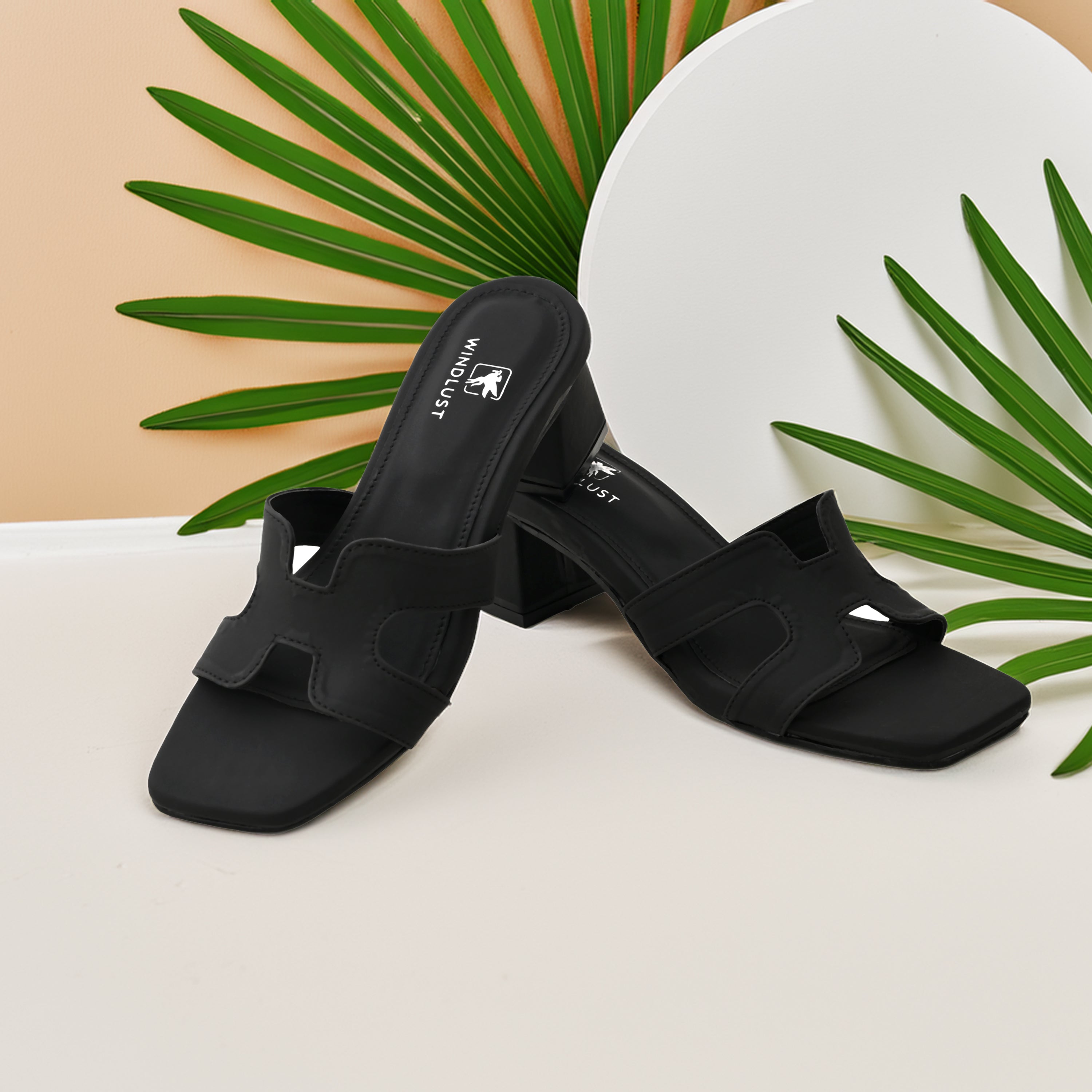 Windlust 4-way cut solid black heels featuring a stylish design, perfect for versatile fashion statements.