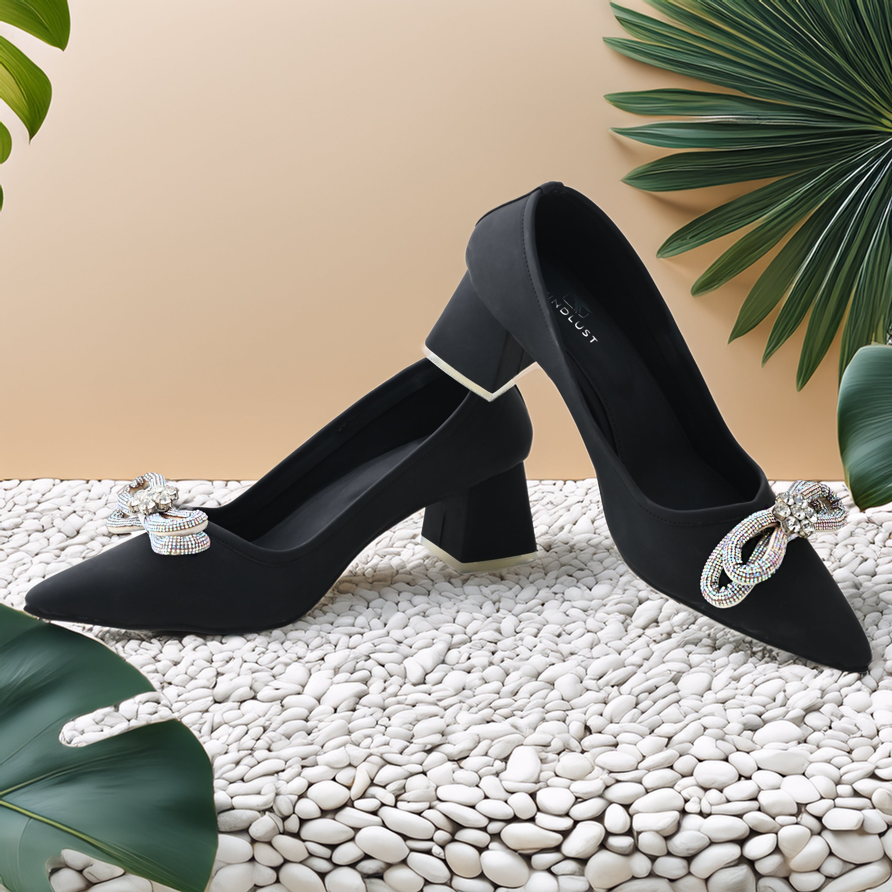 Jet black Windlust block heels with elegant bow embellishments, sleek design, perfect for stylish formal and casual wear.