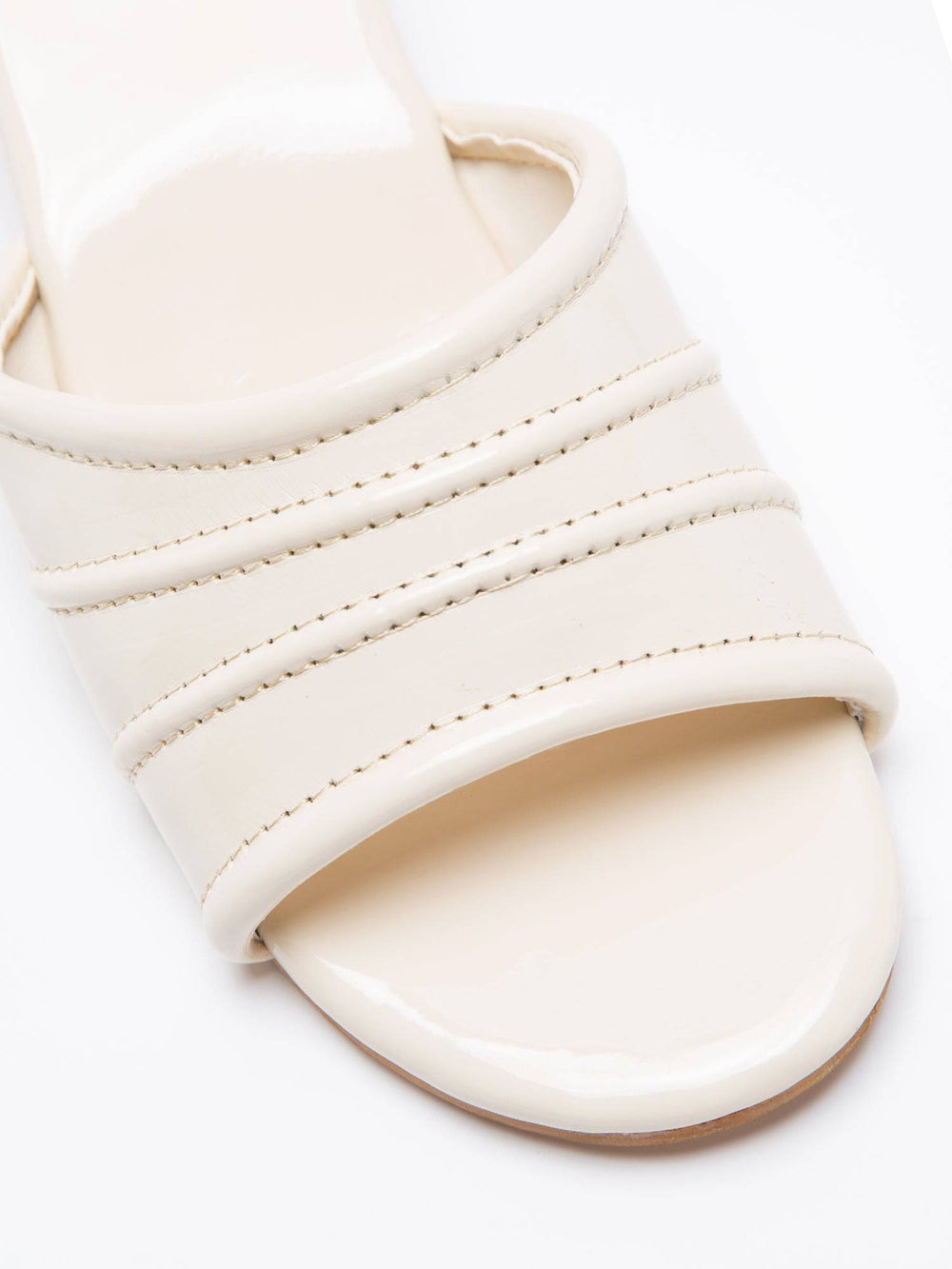 Cream glossy pumps with spherical heel from Windlust, stylish high heels for elegant occasions.