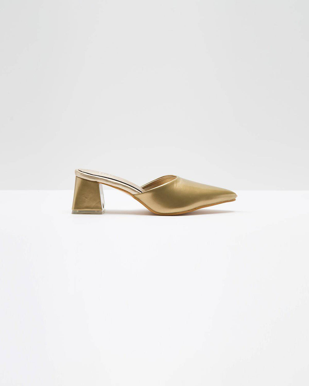 Solid golden Windlust mule shoes featuring a sleek design and pointed toe, perfect for stylish and comfortable wear.
