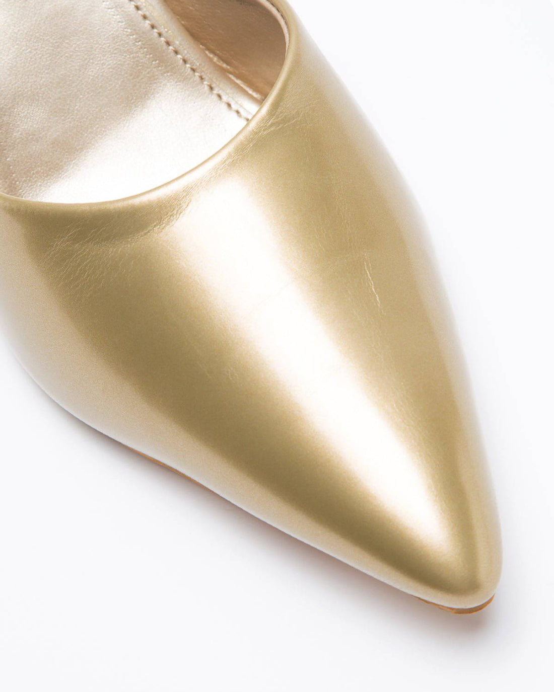 Golden solid mule shoe by Windlust, showing a sleek, slip-on mule with a smooth, shiny finish and elegant design.