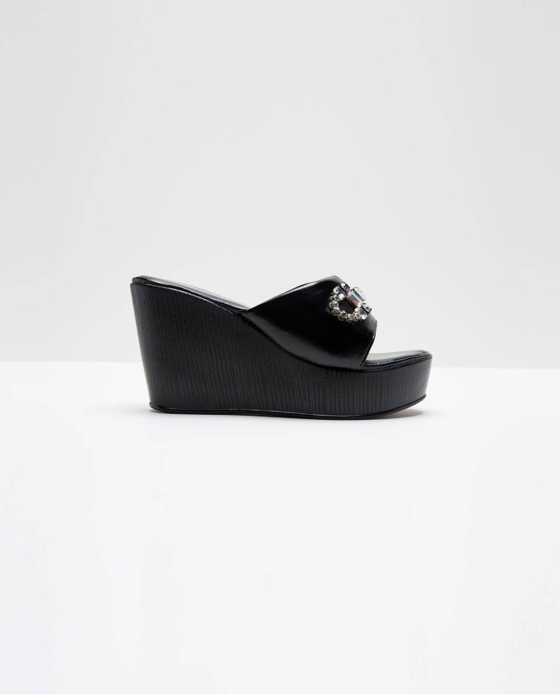Black Stone Embellished Wedges by Windlust featuring a stylish, comfortable wedge heel with decorative stone accents.